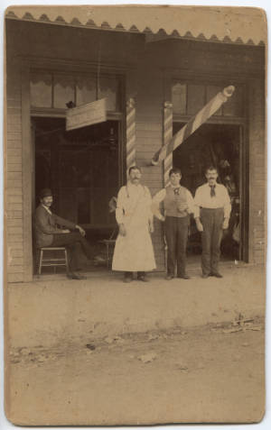 Barber shop and Texas Steam Laundry branch offices, San Antonio, Tex. Lawrence T. Jones III Texas Photography Collection, DeGolyer Library, SMU